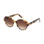 Lunettes de soleil larges, de couleur ecaille marron, vues de profil